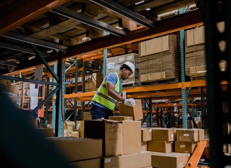 Warehouse worker stacking boxes