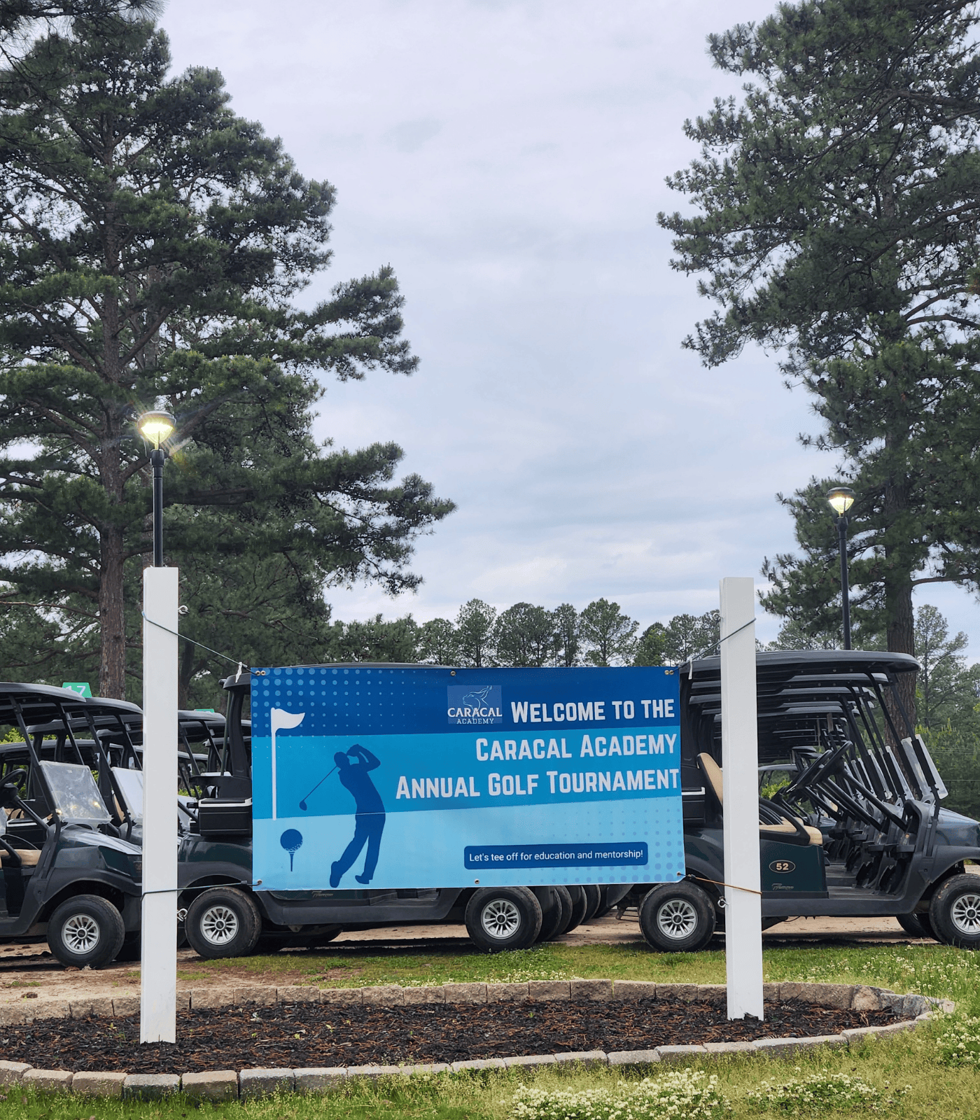 Caracal Academy Golf Tournament sign